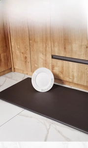 Detail of dark brown anti-fatigue PU leather kitchen mat with shock absorption feature