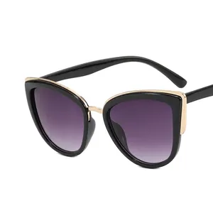 Women's vintage cat eye sunglasses with black frame, gold accents and purple gradient lenses