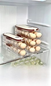 Macro view of multi-layer rolling egg storage box inside refrigerator side door