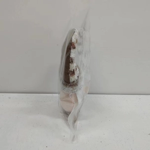 Packaged plush reindeer ornament in clear plastic bag for Christmas door decoration
