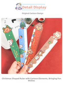 Close-up of 4 cartoon Christmas magnetic rulers featuring Santa and Reindeer motifs