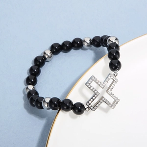 Elastic stainless steel beaded bracelet with a hollow rhinestone cross charm for women