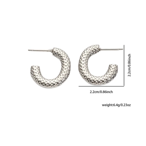 Detailed view of silver C-shaped earrings with honeycomb texture and size dimensions