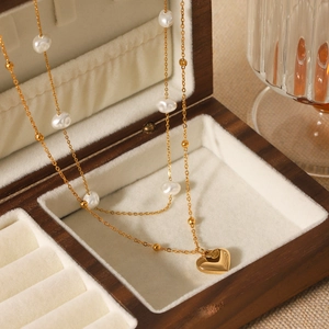 Double-layer gold stainless steel heart pendant necklace with pearls on jewelry box