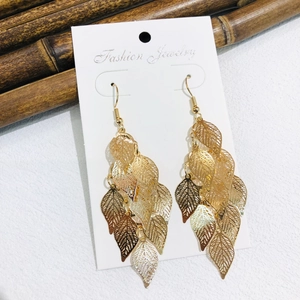 Elegant gold layered hollow leaf tassel drop earrings for women in a natural bohemian style