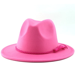Close-up of rose pink fedora hat with woven rope band and tassel detail on brim