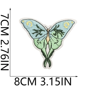 Detailed embroidery texture of a green butterfly patch with dimensions 8x7cm on white background