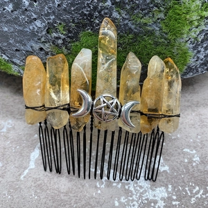Handmade yellow crystal hair comb with triple moon pentagram on natural mossy stone