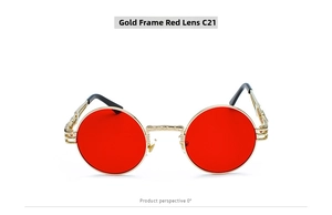 Detail of round steampunk sunglasses with golden metal frame and vibrant red lenses