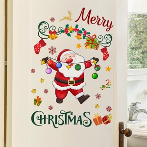 DIY Christmas wall decals with Santa Claus and stars applied to a bathroom wall