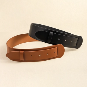 Detail of wide black and brown leather waist belts with metal grommets and rivets