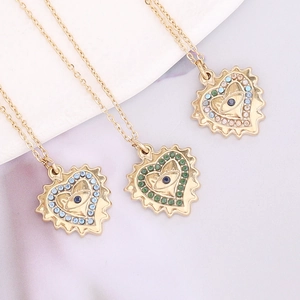Chic stainless steel necklace with gold heart pendant and colorful eye pattern crystals