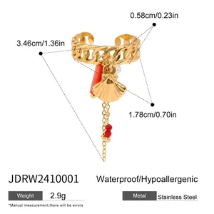 Detail view of gold chain ear cuff with shell and pearl charms with size markings