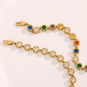 Detailed shot of 18K gold plated bracelets with white and multicolor cubic zirconia stones