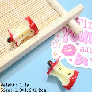 Detailed view of realistic resin apple core charms for DIY crafts with size 1.9x1.2cm