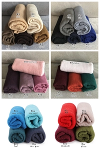 Detail showcasing variety of 26 colors in ribbed textured cotton linen scarf collection