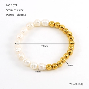 Detailed view of baroque pearl and 18k gold plated stainless steel beaded bracelet