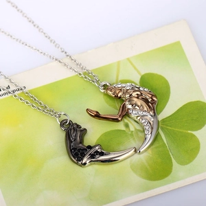 Matching mermaid couple necklaces in gold and black with sparkling crystal embellishments