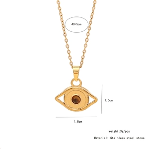 Detail view of eye-shaped tiger stone pendant with stainless steel chain dimensions