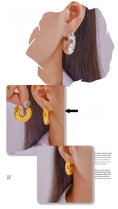 Detail view of chunky C-shaped hoop earrings in polished gold and silver metallic finishes