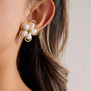 Elegant 18K gold stainless steel flower earrings with opal pearl petals on model