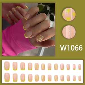 French avocado green press-on nails with yellow heart designs and square shape