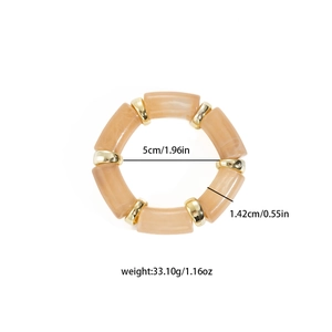 Detailed view of amber resin tube bracelet showing 5cm inner diameter and dimensions