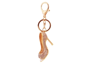 Detail of high heel keychain with pink rhinestones and golden lobster clasp closure