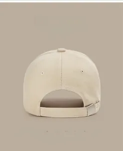 Detail of adjustable metal buckle on beige cotton baseball cap with seven color options