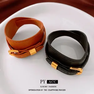 Vintage faux leather belt style choker in brown and black with golden buckles