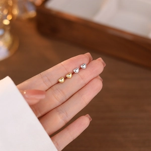 Elegant S999 sterling silver heart stud earrings in gold and silver finishes