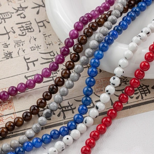 Close-up of polished 4-12mm natural stone round beads for DIY jewelry making and necklaces
