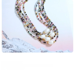 Detailed view of multilayer colorful natural stone necklace with baroque pearls