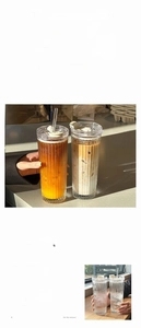 Macro detail of vertical striped glass cup with soda lime glass texture and clear straw