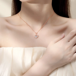 Rose gold S925 sterling silver infinity heart necklace with sparkling moissanite on model