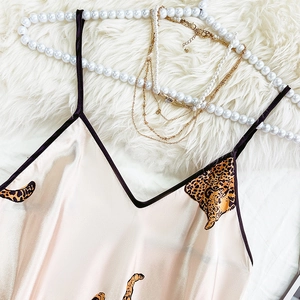 Pink satin slip dress with bold leopard print and thin black shoulder straps
