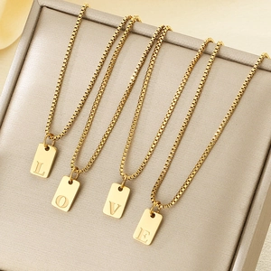 Golden stainless steel box chain necklaces with square LOVE letter pendants shown at 45-degree angle