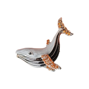 Elegant silver whale brooch with black enamel and sparkling orange rhinestones