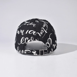 Rear view of black graffiti baseball cap with adjustable metal buckle and distressed fabric