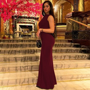 Detailed side view of a burgundy slim fit sleeveless evening dress with mermaid hem