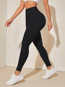 Side view of high-waisted seamless black yoga pants showing butt-lifting shape and lines