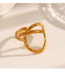 Detailed macro view of the gold hollow oval ring with vintage hammered metal texture