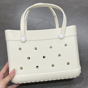 Detailed close-up of a white lightweight EVA DIY beach tote bag with perforated design