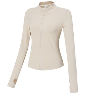Veste de sport beige ajustée avec col montant et passe-pouces pour la course à pied