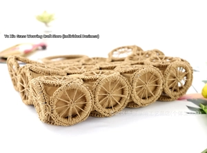 Detailed view of handmade woven straw bag with geometric circular patterns and lining