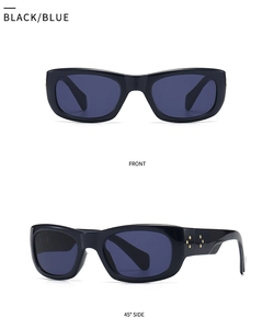 Close-up of square black sunglasses with blue lenses and star rivets on the side