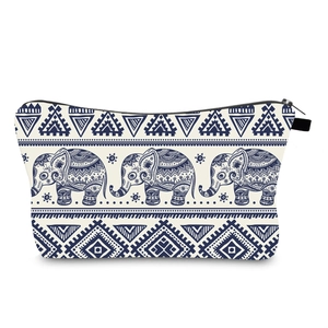 Close-up of waterproof makeup bag with navy blue elephant print and zipper detail