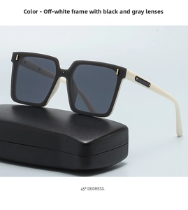 Detail of cream large frame square sunglasses with dark grey lenses and golden metal studs