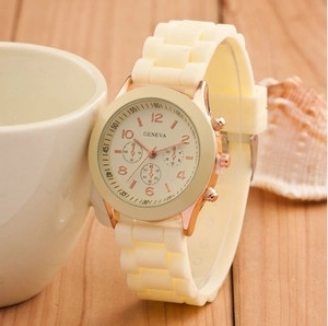 Close-up of Geneva quartz watch with cream silicone strap and rose gold round case