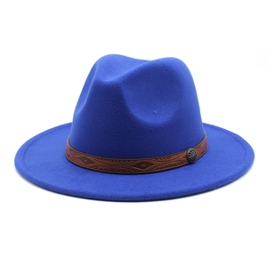 Close-up of bright blue felt fedora with embossed leather band and metallic buckle